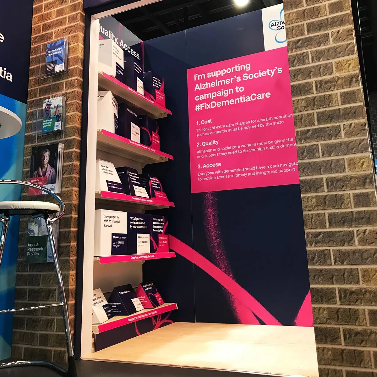 Alzheimer's Society conference stand with care-service products on shelves